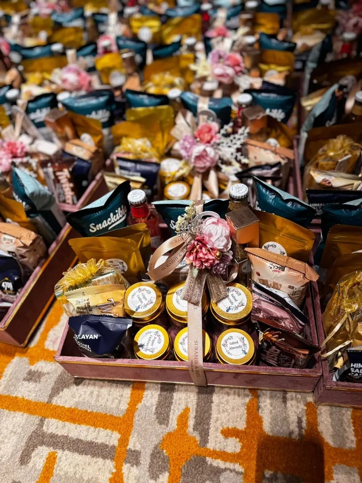 Festive hamper tray with packaged treats and florals